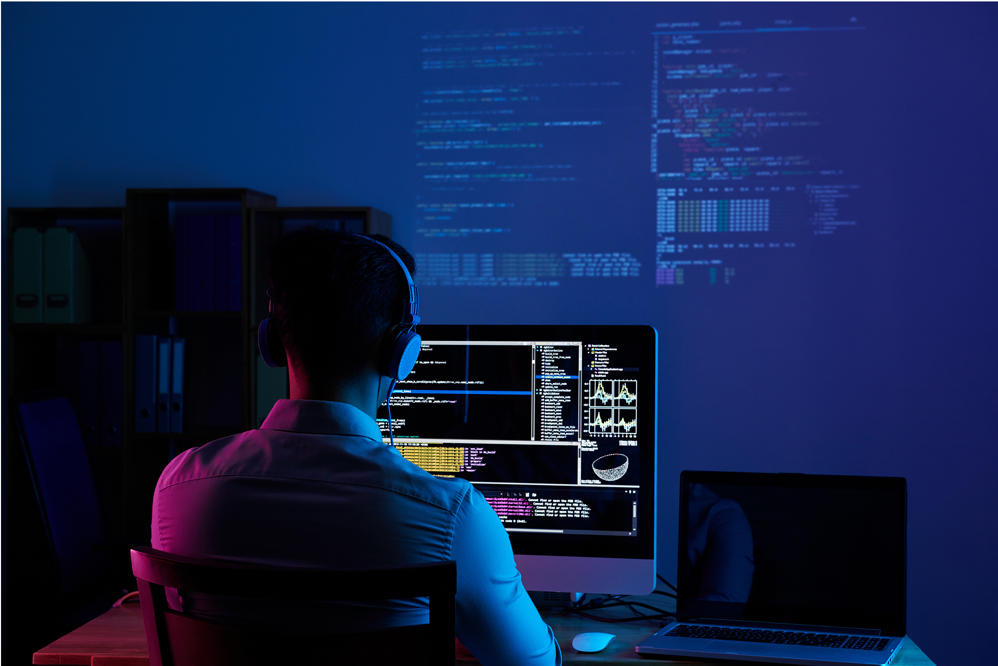 Developer working on laptop with no-code solutions